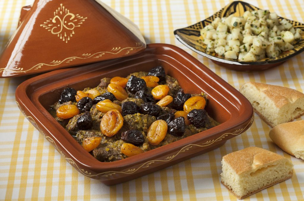 Square tagine with apricots and prunes, potato salad and bread